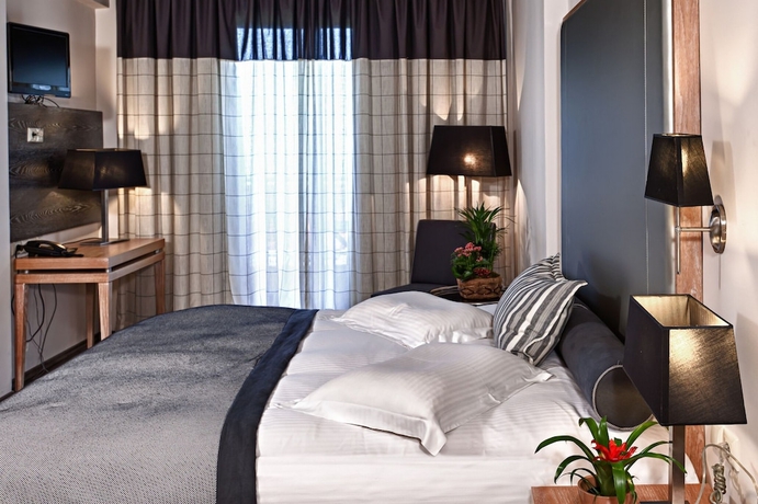 Imagen de la habitación del Hotel Olympus Thea Boutique. Foto 9