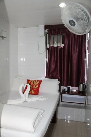 Imagen de la habitación del Hotel Om Guest House, Kowloon. Foto 11