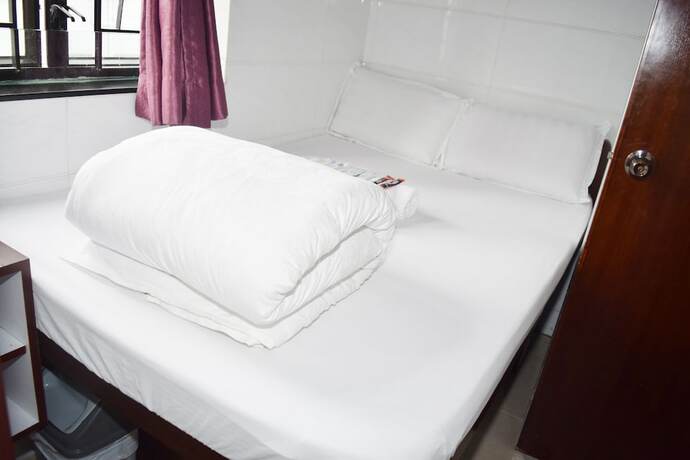 Imagen de la habitación del Hotel Om Guest House, Kowloon. Foto 12
