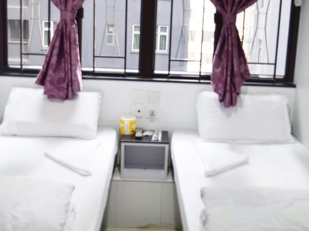 Imagen de la habitación del Hotel Om Guest House, Kowloon. Foto 13