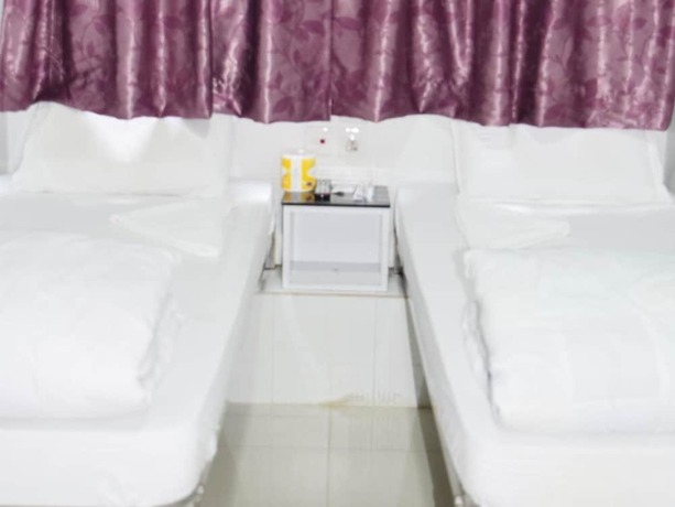 Imagen de la habitación del Hotel Om Guest House, Kowloon. Foto 14