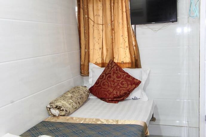 Imagen de la habitación del Hotel Om Guest House, Kowloon. Foto 15