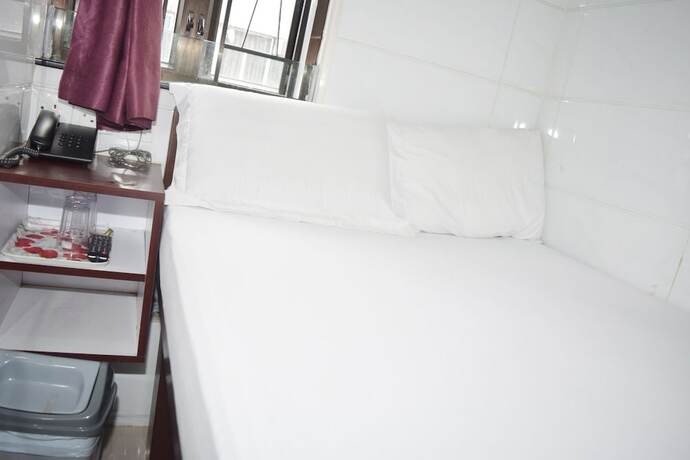 Imagen de la habitación del Hotel Om Guest House, Kowloon. Foto 17