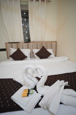 Imagen de la habitación del Hotel Om Palace Inn. Foto 3