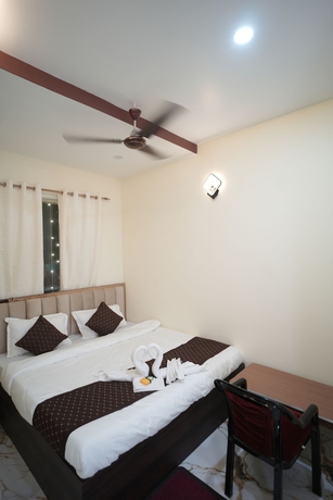 Imagen de la habitación del Hotel Om Palace Inn. Foto 8