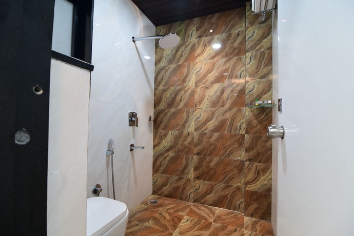 Imagen de la habitación del Hotel Om Stay Well. Foto 12