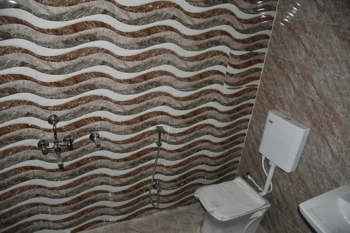 Imagen de la habitación del Hotel Om palace, Karchana. Foto 12