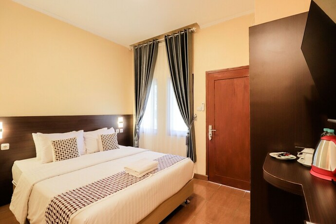 Imagen de la habitación del Hotel Omah Rohadi Syariah by Ndalem Beong. Foto 20