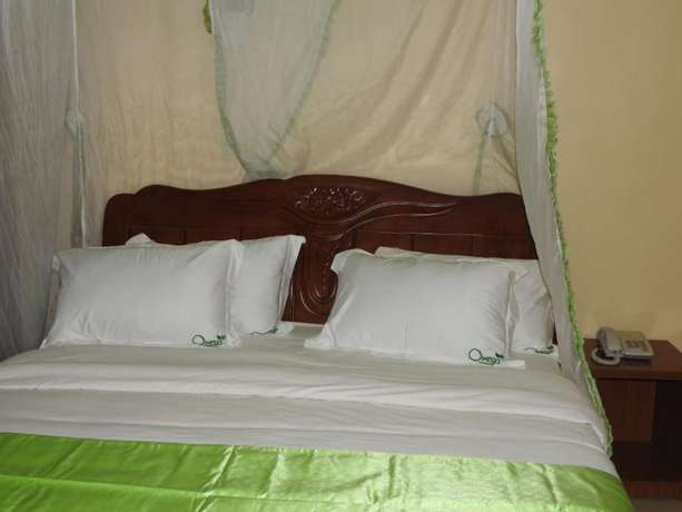 Imagen de la habitación del Hotel Omega Gardens. Foto 8