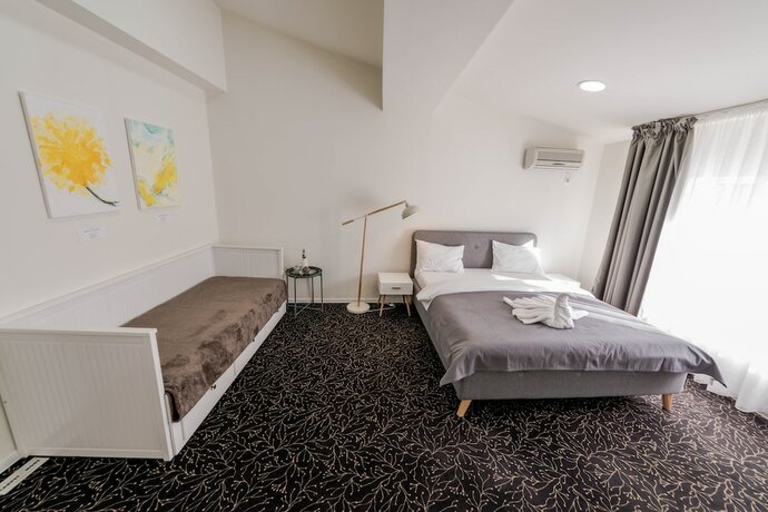Imagen de la habitación del Hotel Omega House. Foto 19
