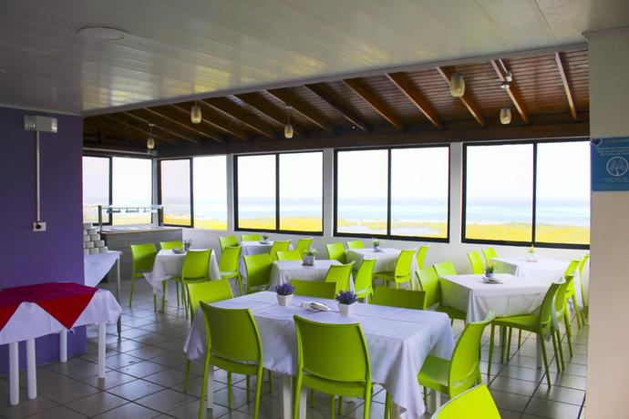 Imagen del bar/restaurante del Hotel On Vacation Magic Hill. Foto 2
