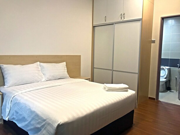 Imagen de la habitación del Hotel One Amerin Mall and Suites. Foto 19