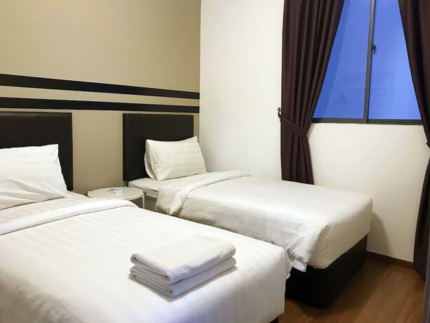 Imagen de la habitación del Hotel One Amerin Mall and Suites. Foto 25