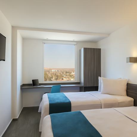 Imagen de la habitación del Hotel One Chihuahua Fashion Mall. Foto 13
