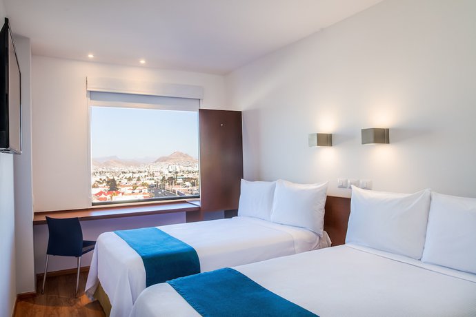 Imagen de la habitación del Hotel One Chihuahua Fashion Mall. Foto 14