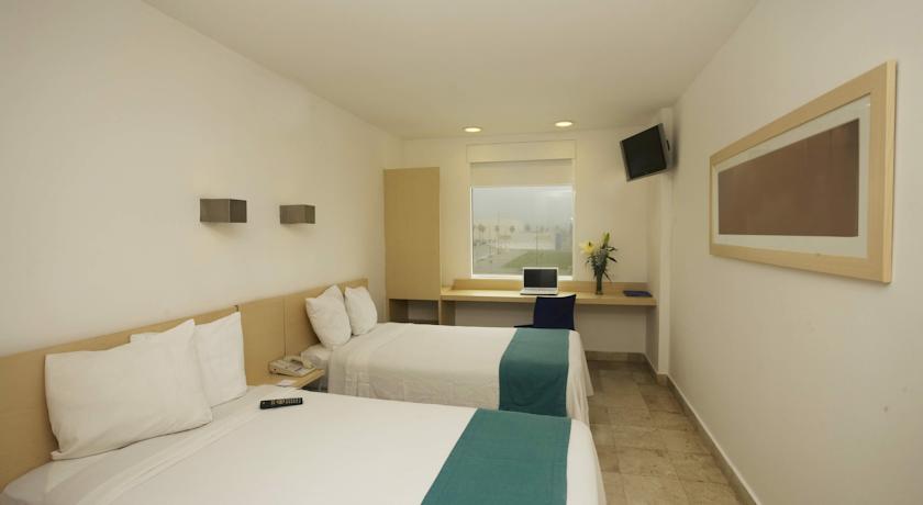 Imagen de la habitación del Hotel One Coatzacoalcos Forum. Foto 3