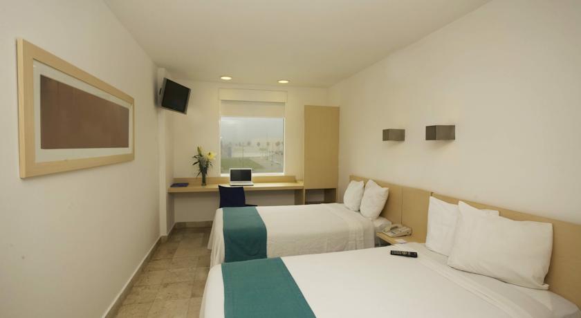 Imagen de la habitación del Hotel One Coatzacoalcos Forum. Foto 4