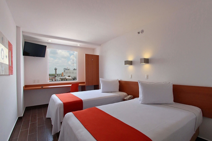 Imagen de la habitación del Hotel One Guadalajara Centro Histórico. Foto 12