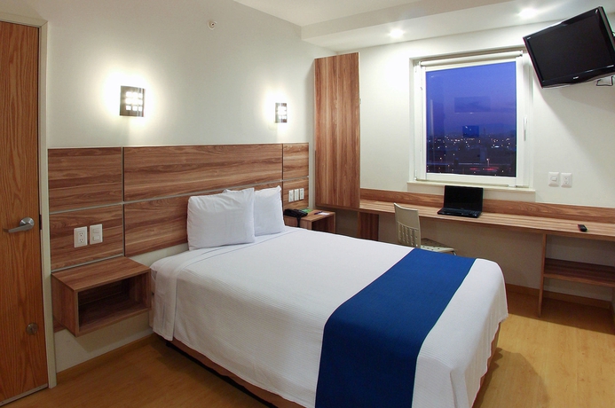 Imagen de la habitación del Hotel One Guadalajara Periferico Norte. Foto 11