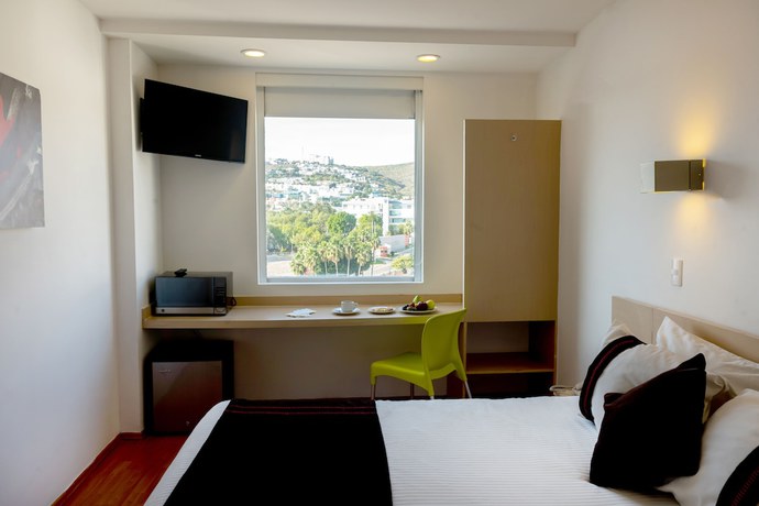 Imagen de la habitación del Hotel One Irapuato. Foto 13