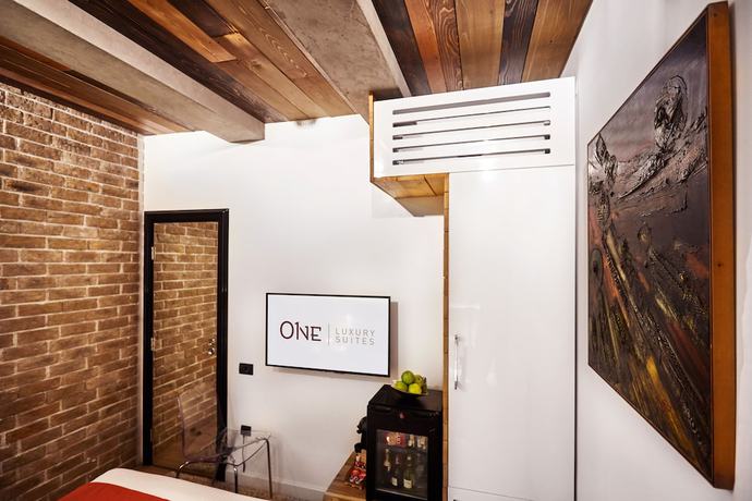 Imagen de la habitación del Hotel One Luxury Suites. Foto 6