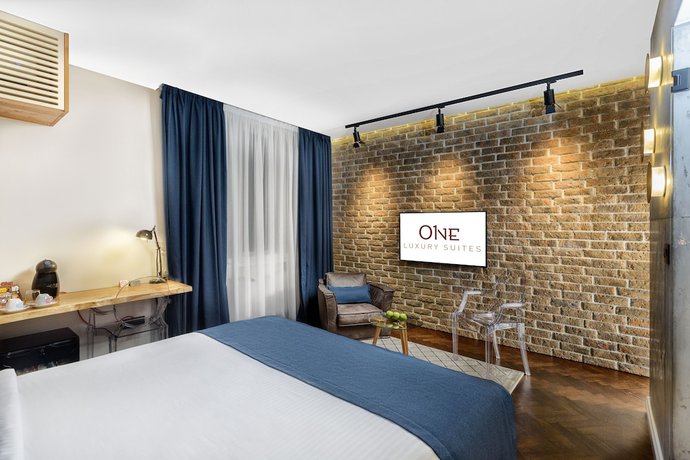 Imagen de la habitación del Hotel One Luxury Suites. Foto 19