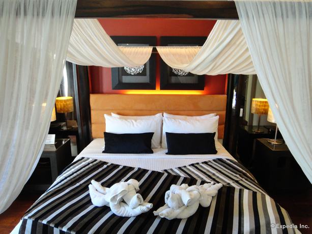 Imagen de la habitación del Hotel One Manalo Place. Foto 17