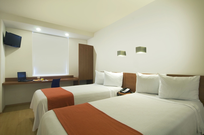 Imagen de la habitación del Hotel One Puebla Finsa. Foto 7