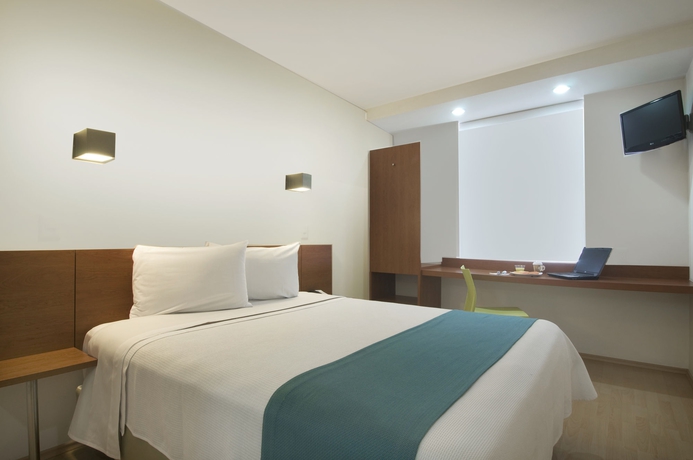 Imagen de la habitación del Hotel One Puebla Finsa. Foto 8