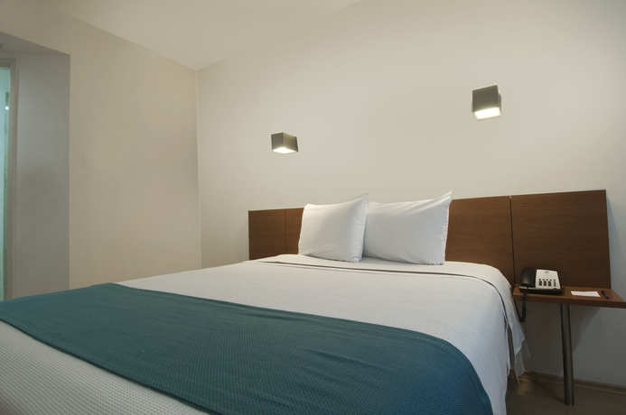 Imagen de la habitación del Hotel One Puebla Finsa. Foto 9