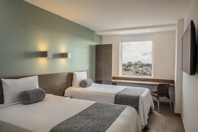 Imagen de la habitación del Hotel One Puebla Serdan. Foto 24