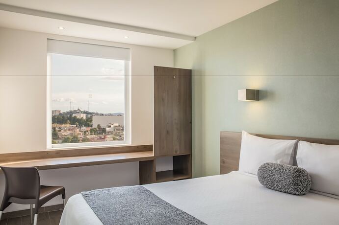 Imagen de la habitación del Hotel One Puebla Serdan. Foto 27