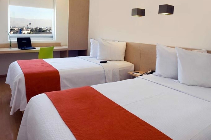 Imagen de la habitación del Hotel One Puerto Vallarta Aeropuerto. Foto 6