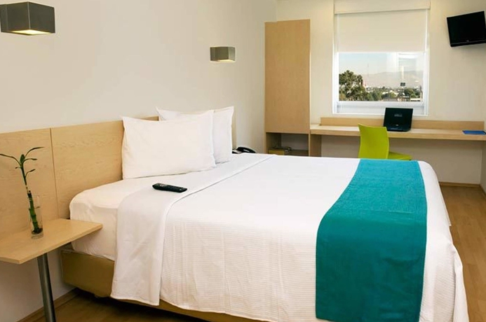 Imagen de la habitación del Hotel One Puerto Vallarta Aeropuerto. Foto 7