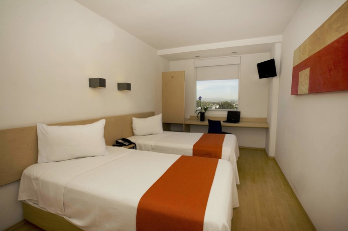 Imagen de la habitación del Hotel One Querétaro Plaza Galerías. Foto 4