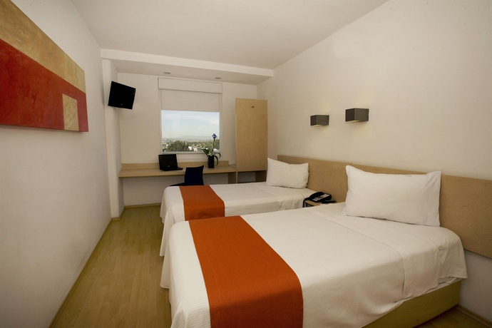 Imagen de la habitación del Hotel One Querétaro Plaza Galerías. Foto 5