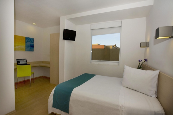 Imagen de la habitación del Hotel One Querétaro Plaza Galerías. Foto 6