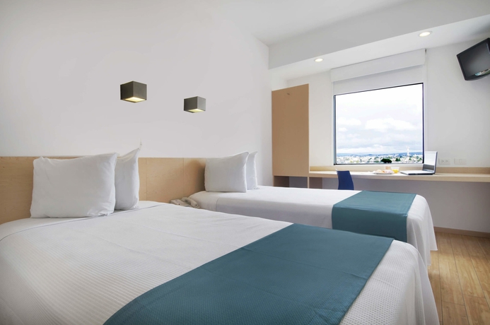 Imagen de la habitación del Hotel One Toluca Aeropuerto. Foto 5