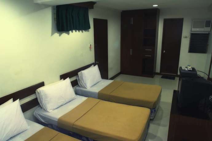 Imagen de la habitación del Hotel Ong Bun Pension House Bacolod. Foto 6