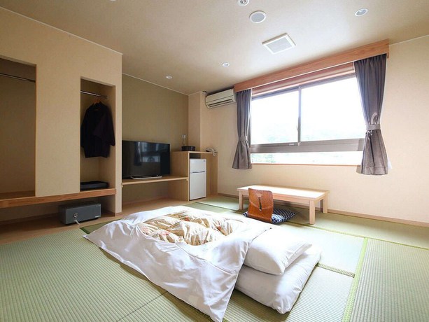 Imagen de la habitación del Hotel Ooedo Onsen Monogatari Premium Kinosaki. Foto 4