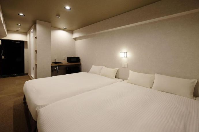 Imagen de la habitación del Hotel Ookini Hotels Dotonbori Apartment. Foto 11