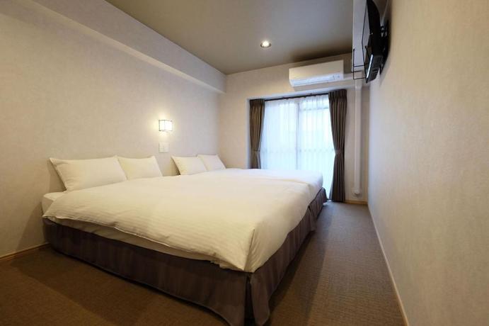 Imagen de la habitación del Hotel Ookini Hotels Dotonbori Apartment. Foto 12