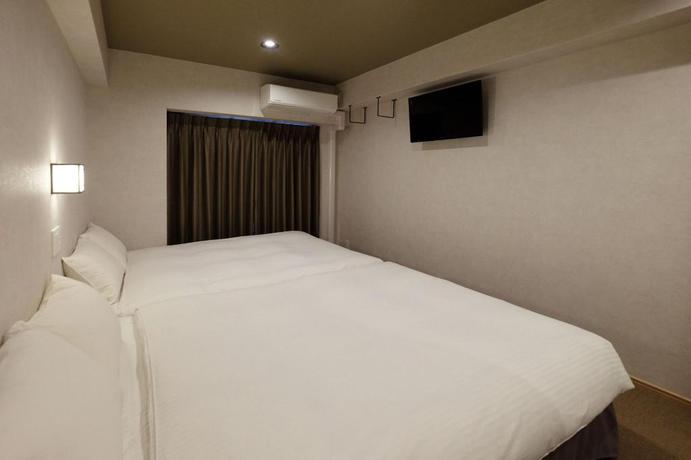 Imagen de la habitación del Hotel Ookini Hotels Dotonbori Apartment. Foto 13