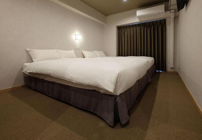 Imagen de la habitación del Hotel Ookini Hotels Dotonbori Apartment. Foto 14