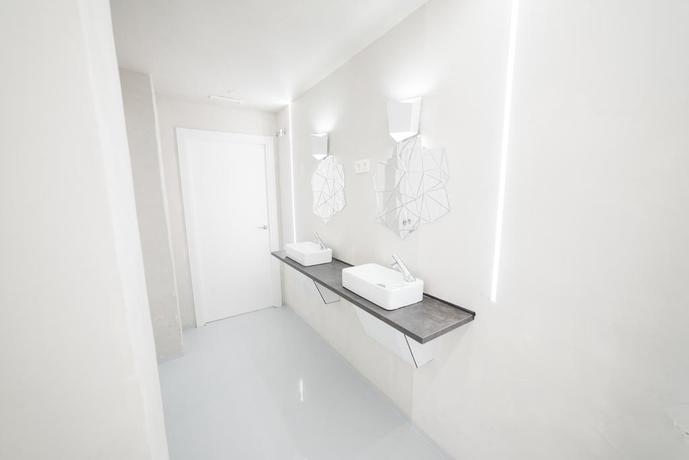 Imagen de los interiores del Hotel Optimi Rooms. Foto 6