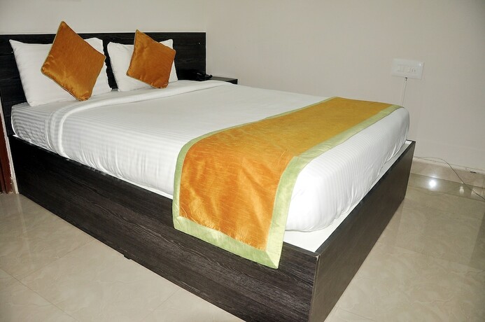 Imagen de la habitación del Hotel Orange Comforts. Foto 16