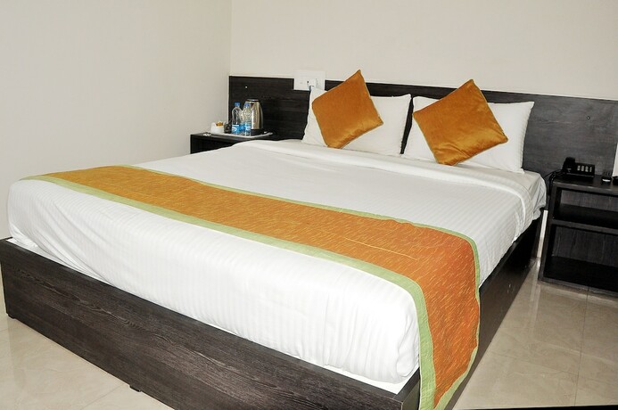 Imagen de la habitación del Hotel Orange Comforts. Foto 17