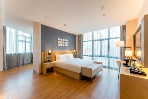 Imagen de la habitación del Hotel Orange Crystal Shanghai Bund North Sichuan Road. Foto 12