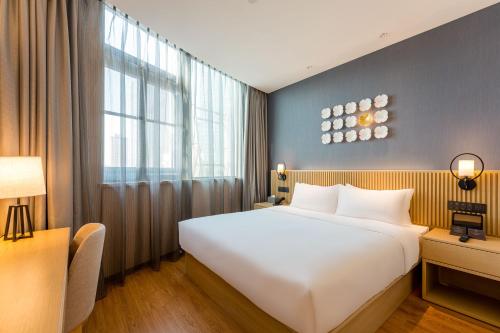 Imagen de la habitación del Hotel Orange Crystal Shanghai Bund North Sichuan Road. Foto 14
