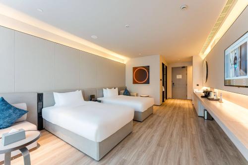 Imagen de la habitación del Hotel Orange Crystal Shanghai Bund North Sichuan Road. Foto 15